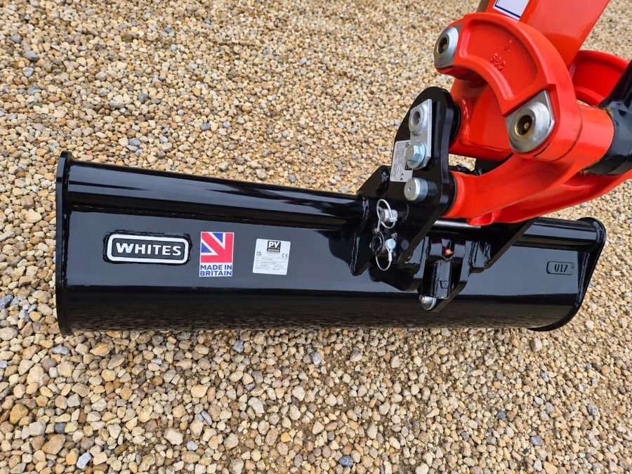 Grading bucket fitted to the quick hitch of a Kubota mini excavator