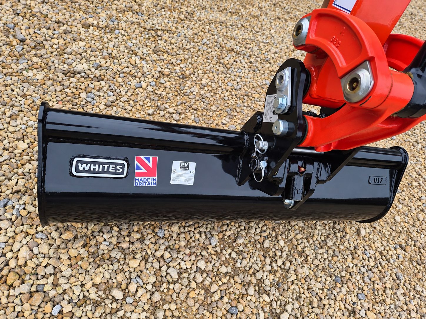 Grading bucket fitted to the quick hitch of a Kubota mini excavator